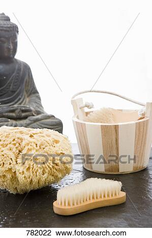 Still life with spa products and a Buddha statue View Large Photo Image Stock Image - Still life with spa products and a Buddha statue. Fotosearch