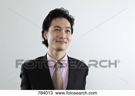 A businessman looking away, portrait View Large Photo Image Stock Image - A businessman looking away, portrait. Fotosearch