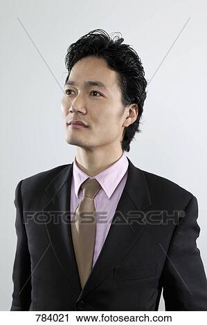 Stock Image - A businessman with aspirations, portrait. Fotosearch
