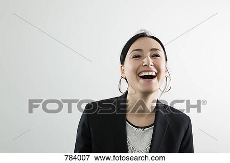 A businesswoman laughing, portrait View Large Photo Image Stock Photo - A businesswoman laughing, portrait. Fotosearch