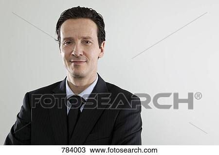 Stock Image - A content businessman, portrait. Fotosearch