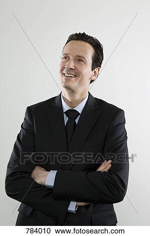 Stock Image - A happy businessman, portrait. Fotosearch