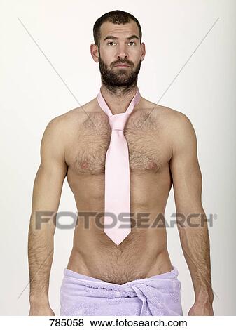 A man wearing a tie and wrapped in a towel View Large Photo Image Stock Photo - A man wearing a tie and wrapped in a towel. Fotosearch