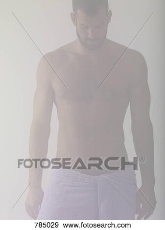 A man wrapped in a towel View Large Photo Image Stock Photo - A man wrapped in a towel. Fotosearch