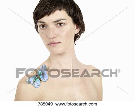 A woman with a butterfly on her shoulder View Large Photo Image Stock Photo - A woman with a butterfly on her shoulder. Fotosearch