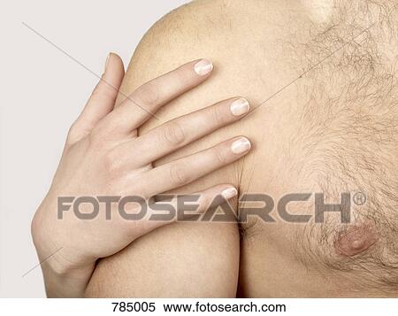 A woman's hand on a man's shoulder View Large Photo Image Stock Photography - A woman's hand on a man's shoulder. Fotosearch