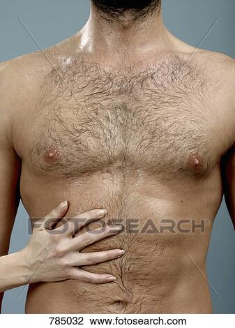 A woman's hand touching a man's abdomen View Large Photo Image Stock Image - A woman's hand touching a man's abdomen. Fotosearch