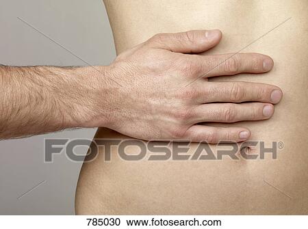 Detail of a man touching a woman's abdomen View Large Photo Image Stock Image - Detail of a man touching a woman's abdomen. Fotosearch