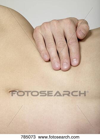 Detail of a man's hand around a woman's waist View Large Photo Image Stock Image - Detail of a man's hand around a woman's waist. Fotosearch