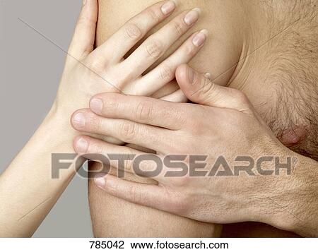 Detail of a woman touching a man's shoulder View Large Photo Image Stock Image - Detail of a woman touching a man's shoulder. Fotosearch