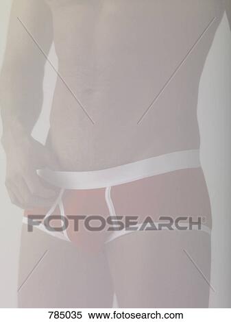 Midsection of a man wearing underpants View Large Photo Image Stock Photography - Midsection of a man wearing underpants. Fotosearch
