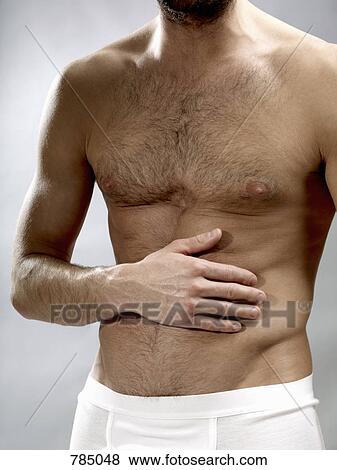 Midsection of a shirtless man View Large Photo Image Stock Photo - Midsection of a shirtless man. Fotosearch