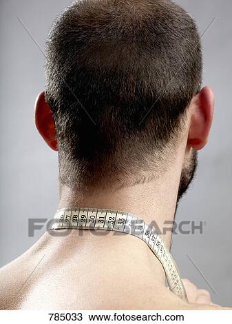 Rear view of a man with a tape measure around his neck View Large Photo Image Stock Image - Rear view of a man with a tape measure around his neck. Fotosearch