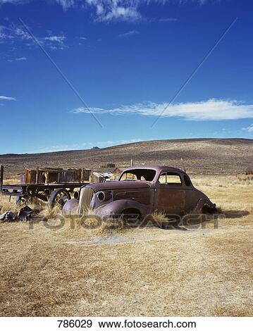 An old abandoned car in a field, Bodie State Historic Park, California, USA View Large Photo Image Stock Photo - An old abandoned car in a field, Bodie State Historic Park, California, USA. Fotosearch