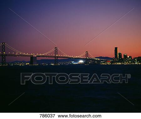 Stock Photo - Oakland Bay Bridge at dusk, San Francisco, California, USA. Fotosearch