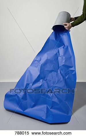 Stock Photography - A bucket of water being poured out. Fotosearch