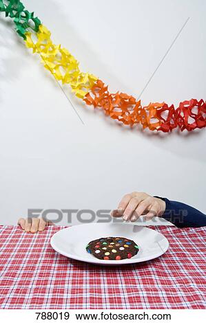 A hand reaching for a cookie View Large Photo Image Stock Photo - A hand reaching for a cookie. Fotosearch