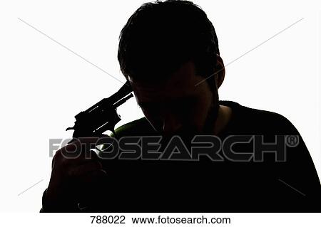 Stock Image - A man holding a gun to his head. Fotosearch