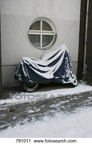 A motorcycle covered in snow View Large Photo Image Stock Image - A motorcycle covered in snow. Fotosearch
