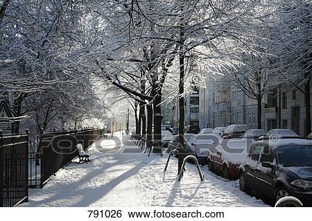 A residential street covered in snow, Berlin, Germany View Large Photo Image Stock Photograph - A residential street covered in snow, Berlin, Germany. Fotosearch