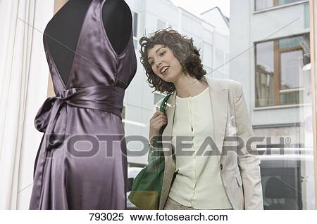 A woman window shopping View Large Photo Image Stock Photography - A woman window shopping. Fotosearch