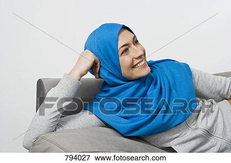 Portrait of a woman wearing a Hijab View Large Photo Image Stock Photo - Portrait of a woman wearing a Hijab. Fotosearch