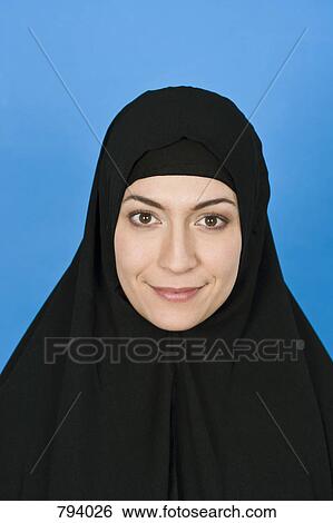 Portrait of a woman wearing a Hijab View Large Photo Image Stock Photograph - Portrait of a woman wearing a Hijab. Fotosearch