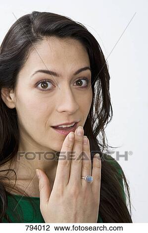 Stock Image - Portrait of a woman with an expression of surprise. Fotosearch