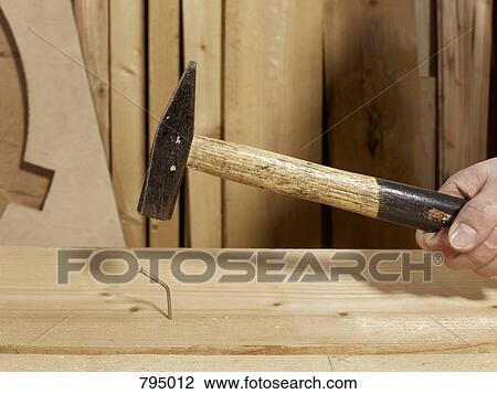 A hammer above a bent nail View Large Photo Image Stock Image - A hammer above a bent nail. Fotosearch