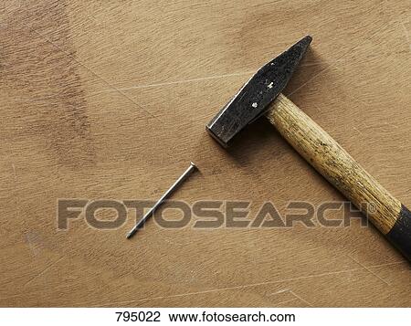 A hammer and a nail View Large Photo Image Stock Image - A hammer and a nail. Fotosearch