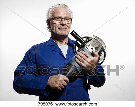 A man clutching a circular saw View Large Photo Image Stock Photograph - A man clutching a circular saw. Fotosearch