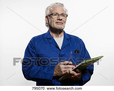 Stock Image - A man holding a clipboard. Fotosearch