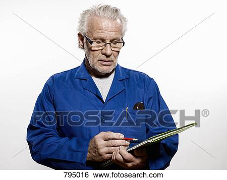 Stock Photograph - A man holding a clipboard. Fotosearch
