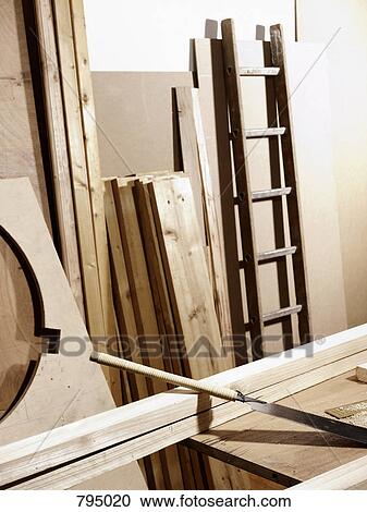 A work bench and planks of wood View Large Photo Image Stock Image - A work bench and planks of wood. Fotosearch