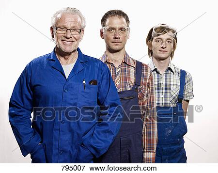 Portrait of three manual workers View Large Photo Image Stock Photo - Portrait of three manual workers. Fotosearch