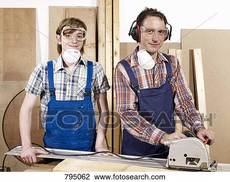 Portrait of two men in a wood workshop View Large Photo Image Stock Image - Portrait of two men in a wood workshop. Fotosearch