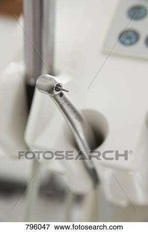 Stock Photo - A dental drill docked in a dental examination room. Fotosearch