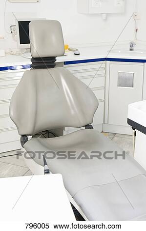 An empty chair in a dental examination room View Large Photo Image Stock Photography - An empty chair in a dental examination room. Fotosearch