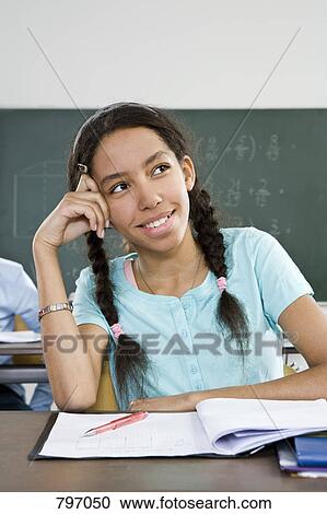 A schoolgirl thinking View Large Photo Image Stock Image - A schoolgirl thinking. Fotosearch
