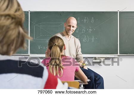 A teacher teaching a class View Large Photo Image Stock Image - A teacher teaching a class. Fotosearch