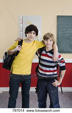 School friends standing side by side View Large Photo Image Picture - School friends standing side by side. Fotosearch