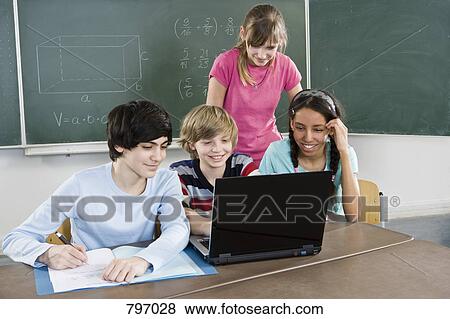 School students using a laptop View Large Photo Image Stock Photo - School students using a laptop. Fotosearch