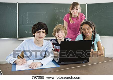 School students working together in a classroom View Large Photo Image Stock Photography - School students working together in a classroom. Fotosearch