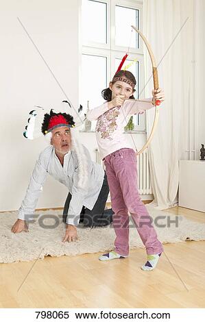 A grandfather and his granddaughter playing make believe View Large Photo Image Stock Photography - A grandfather and his granddaughter playing make believe. Fotosearch