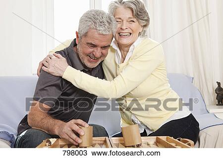 A senior man and a senior woman playing backgammon View Large Photo Image Stock Image - A senior man and a senior woman playing backgammon. Fotosearch