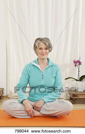 A senior woman doing yoga View Large Photo Image Picture - A senior woman doing yoga. Fotosearch