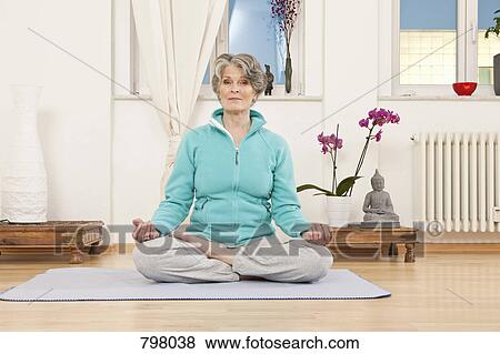 A senior woman doing yoga View Large Photo Image Stock Photo - A senior woman doing yoga. Fotosearch