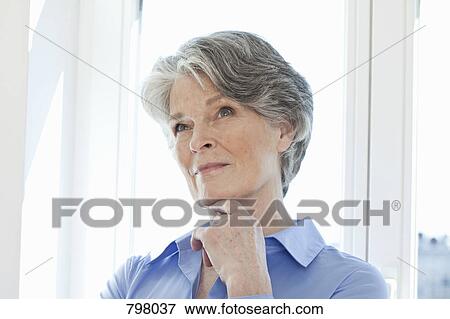 A senior woman thinking, portrait View Large Photo Image Stock Photo - A senior woman thinking, portrait. Fotosearch