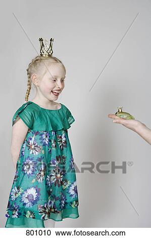 Stock Image - A girl princess and a frog prince. Fotosearch
