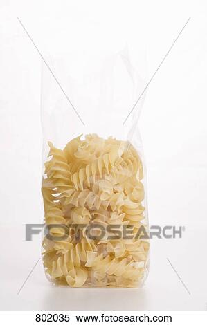 A bag of uncooked fusilli View Large Photo Image Stock Photography - A bag of uncooked fusilli. Fotosearch